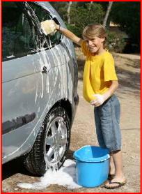 boy washes car to help